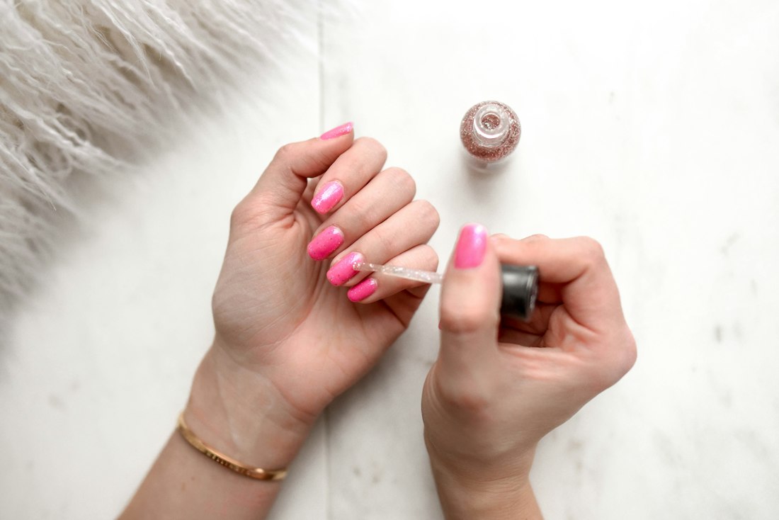 Hands with freshly painted nails