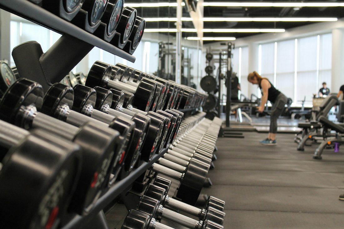 A rack of dumbbells on the gym floor