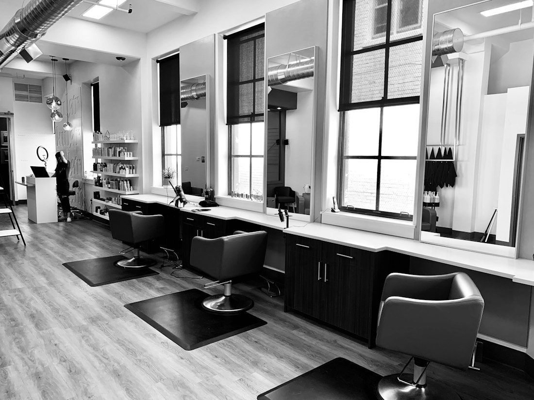A salon interior with chairs and mirrors
